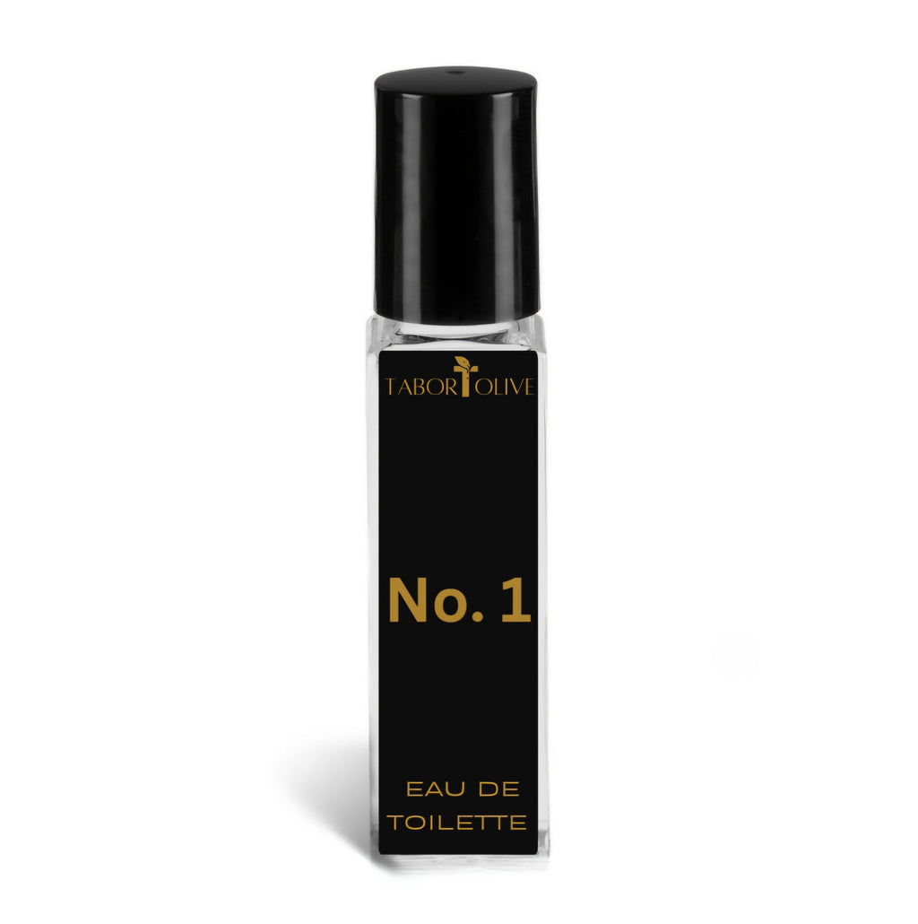 Clear cologne bottle with black cap and a black label with gold text that says, "eau de Toilette. No.1"