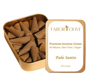 Gold tin with incense cones inside. White label with gold text that says, "premium incense cones. Non-toxic natural vegan"